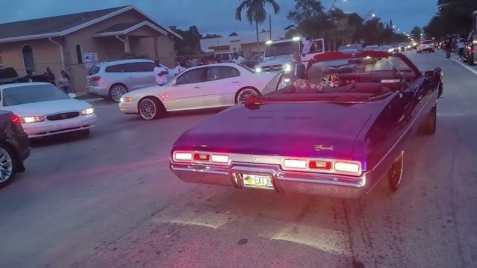 Rick Ross shows off his unique purple supercar at the auto show